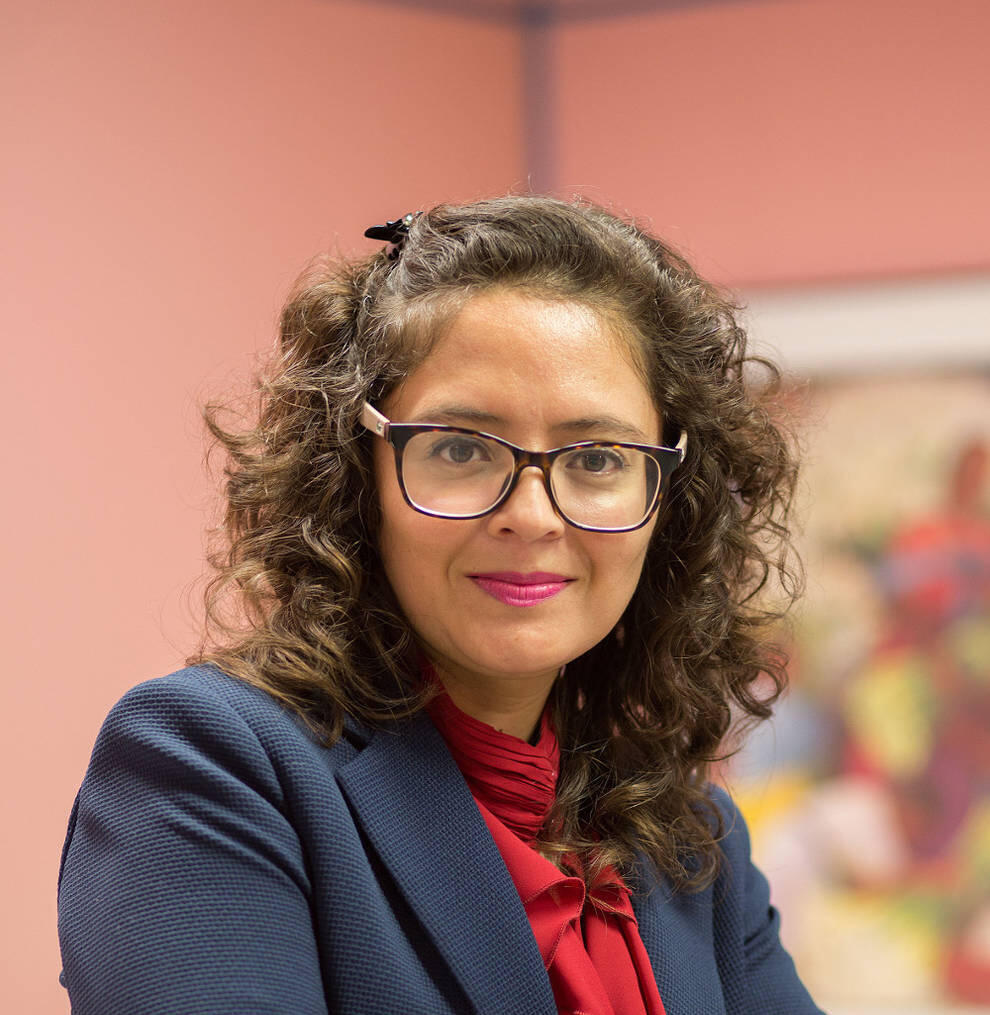 Iovanna Rodriguez Confident professional woman smiling.